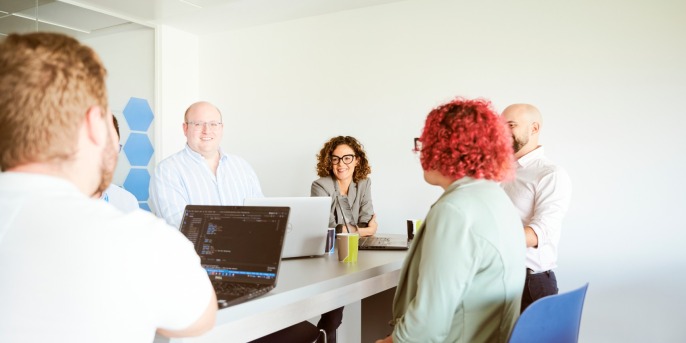 Employee presents on a whiteboard